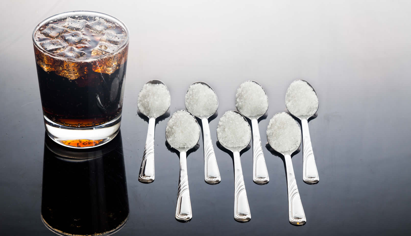 Soft drink and 5 spoons of sugar.