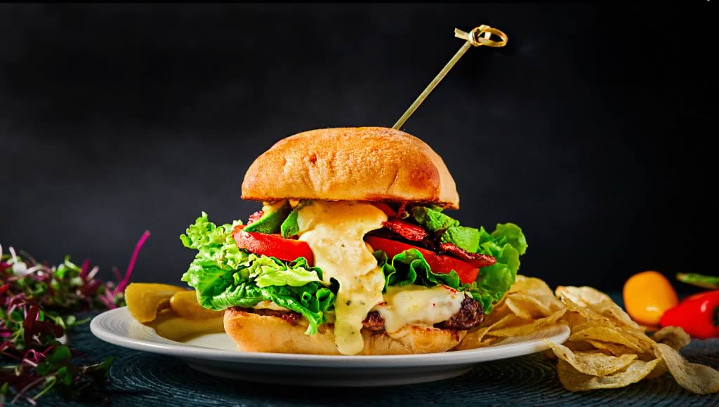 Photo of a cheeseburger made using plant-based meat substitute.